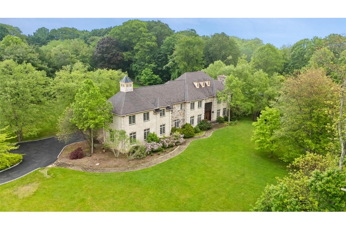 View of subject property featuring a heavily wooded area