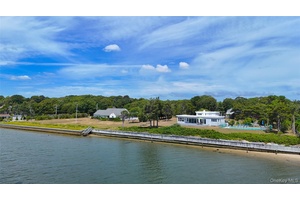This is a truly special offering for the buyer who values both spectacular water views and limitless potential.