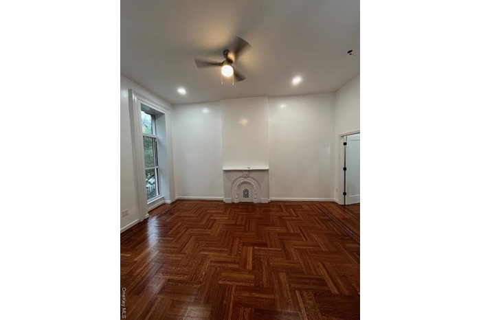 Unfurnished living room with a ceiling fan and recessed lighting
