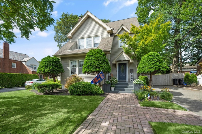 View of front of house featuring a shingled roof