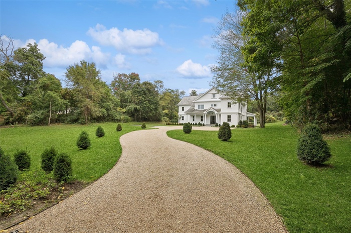 Beautiful elegant stone covered driveway over asphalt