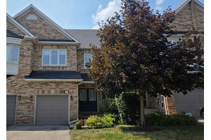Elegant executive 'Acorn' townhome in the prestigious Westbrook Gate community, featuring exquisite interior finishes and high end upgrades throughout !