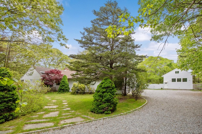 View of yard featuring gravel driveway