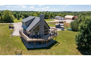 27 acre farm with a shop, storage building and home.