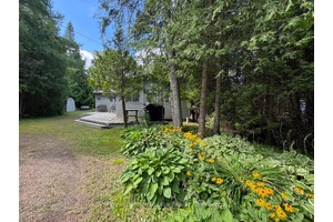 Just a one minute, convenient stroll down a path to the sandy shoreline of Lake Huron, this inviting 3 bedroom, 3 season cottage is ready for your summer enjoyment.