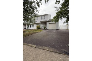 Welcome to 6 Walnut Street, a beautifully maintained home offering comfort and convenience in the heart of Central Islip.