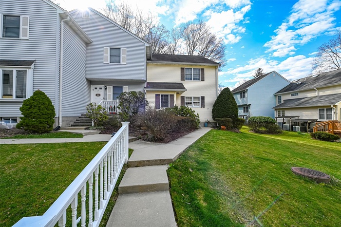 View of front of home featuring a residential view and a front yard