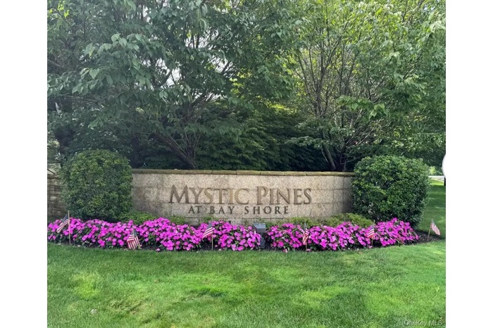 Community sign with a lawn
