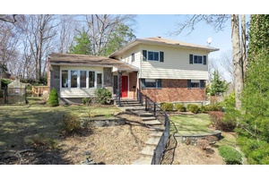 Large Private Split on Oversized Corner Property in Forest Estate Pool Community.