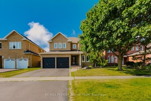 12 Donald Wilson St, a beautifully maintained 4 1 bedroom brick home in the highly sought after Rolling Acres community.