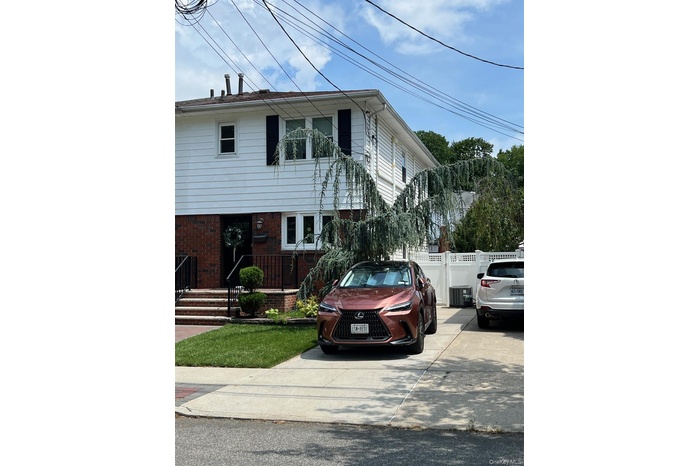 View of front of property featuring brick siding