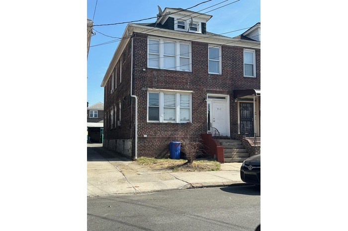 View of front of home featuring brick siding