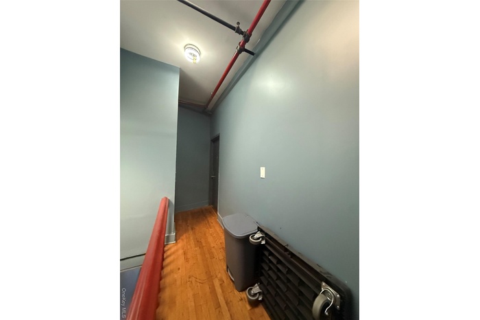 Hallway with light wood-type flooring