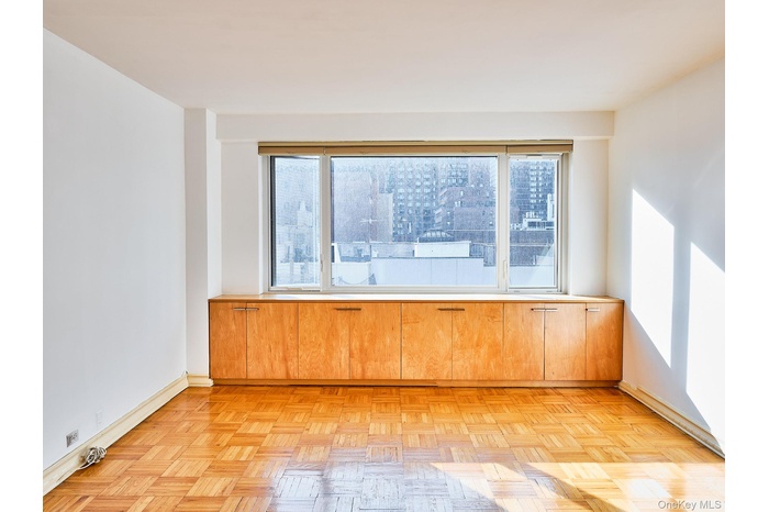 Spare room featuring baseboards