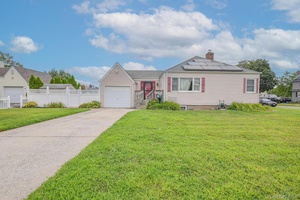 Cozy ranch in the heart of Farmingdale featuring 3 bedrooms and 2 full bathrooms.