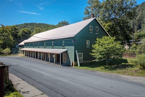 Nestled in the heart of Wassaic Hamlet on Main Street, this meticulously revitalized 1920s two story barn, spanning 10, 640 SF, stands as a testament to craftsmanship and vision.