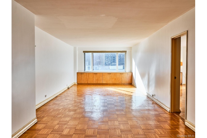 Spacious living room. Facing first Ave.