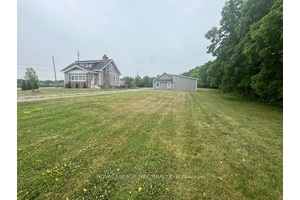 This 3 bedroom two bath home sits on a beautiful 1.