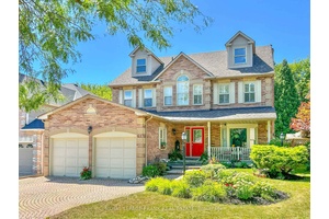 The Welcoming Front Porch offers shade and shelter to enjoy the Landscaped gardens watered by the In Ground Sprinkler System.