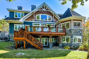 Perched at the end of a private year round paved road and nestled in a sheltered serene bay on Lake Muskoka.