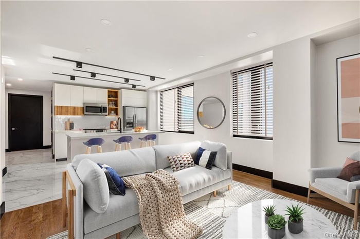 Living room featuring marble finish floor and baseboards