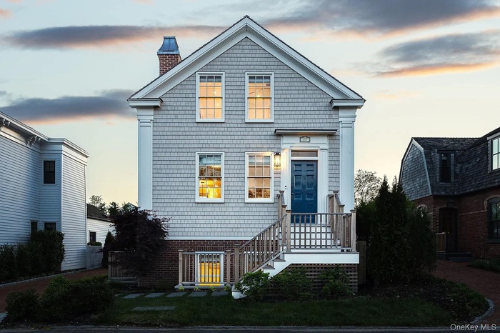 View of front of property with a chimney