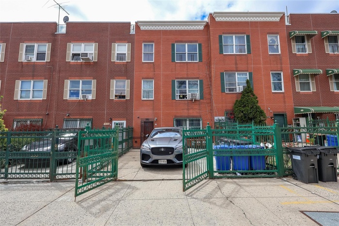 View of building exterior with fence