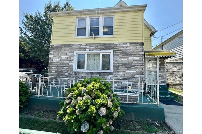 Front view of house with stone siding