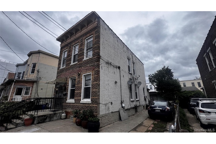 View of side of home with brick siding