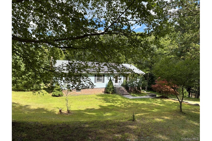 View of front of house featuring a front lawn