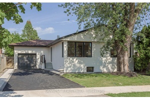 This beautifully renovated detached Raised Bungalow in Etobicoke's desirable West Mall neighbourhood combines timeless charm with luxury modern finishes.
