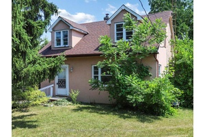 2 Bedroom with Ensuite Laundry in Prestigious South Richvale surrounded by Multi dollar Homes.