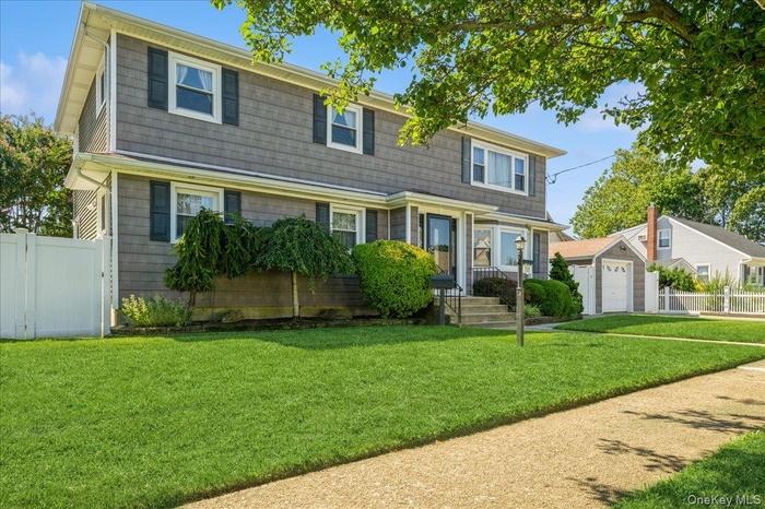 View of front of property with a garage