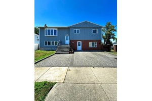 RECENTLY RENOVATED ! ! This raised hi ranch is a boater s dream, located just three houses from the bay on a canal in Freeport.