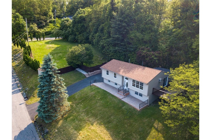 View from above of property with a heavily wooded area