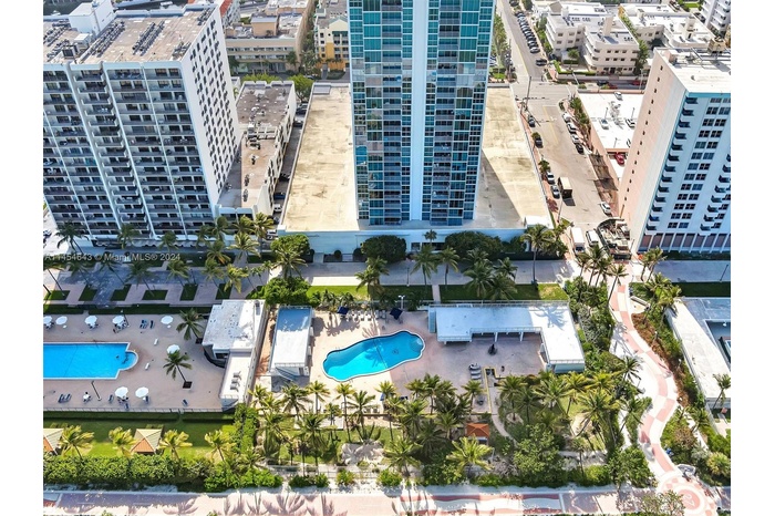 Direct oceanfront building; pool and boardwalk.