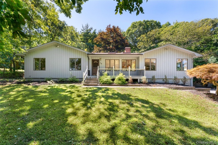 Ranch-style home with board and batten siding