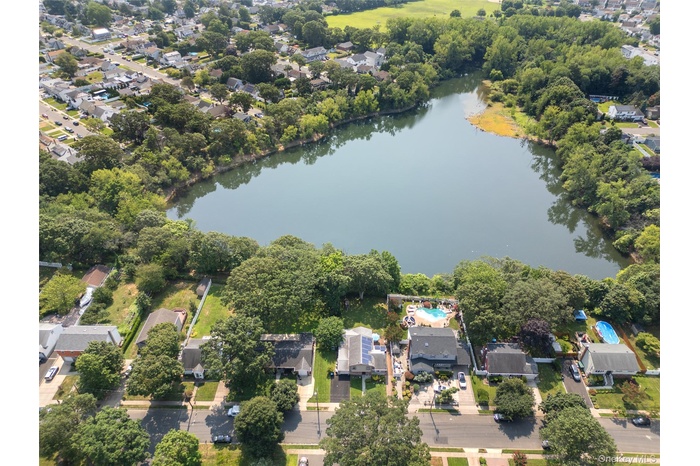 Aerial overview of property's location featuring nearby suburban area