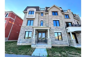 Beautiful 1 year new corner lot townhouse with double garage and 5 spacious bedrooms, offering 2, 333 sq ft of living space.