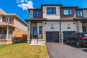 This modern end unit townhome offers nearly 1, 800 sqft of stylish living across three finished levels.