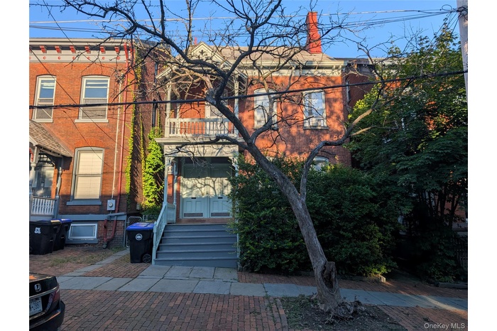 View of front of house featuring brick siding