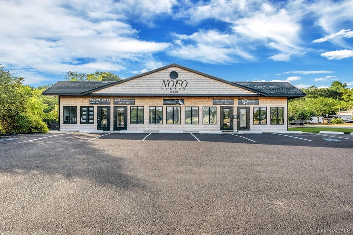 View of commercial location with uncovered parking
