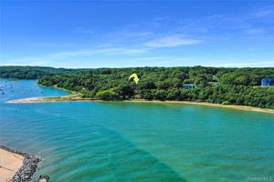 This breathtaking beachfront property in one of Port Jefferson's most prestigious locations is available for the first time in over 50 years !