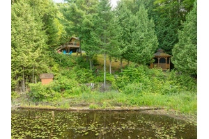 Discover your dream 4 season recreational property on the stunning shores of Little Mississagagon Lake, where natures beauty meets modern comfort in this charming 1, 763 sqft cottage.