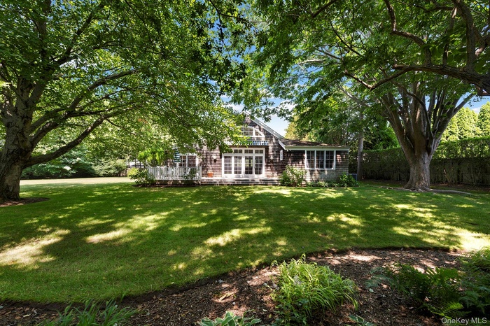 View of yard featuring a wooden deck