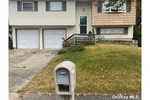 Nice Large Hi Ranch, This Home has 4 bedrooms with one and half bathrooms, Eat In Kitchen, family room, living room dining room, 2 large car garage, very large back ...
