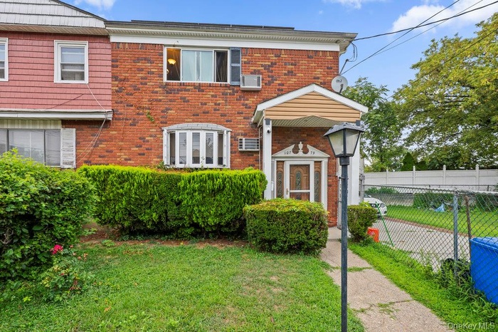 View of front of house featuring brick siding