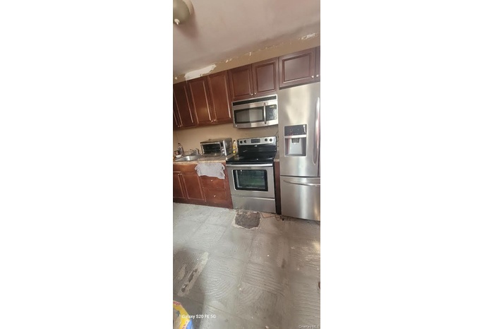 Kitchen featuring appliances with stainless steel finishes