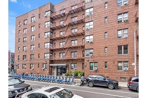 Brilliant sunlight pours into this extra large two bedroom home office perched on the top floor of a beautifully maintained Elmhurst condo.
