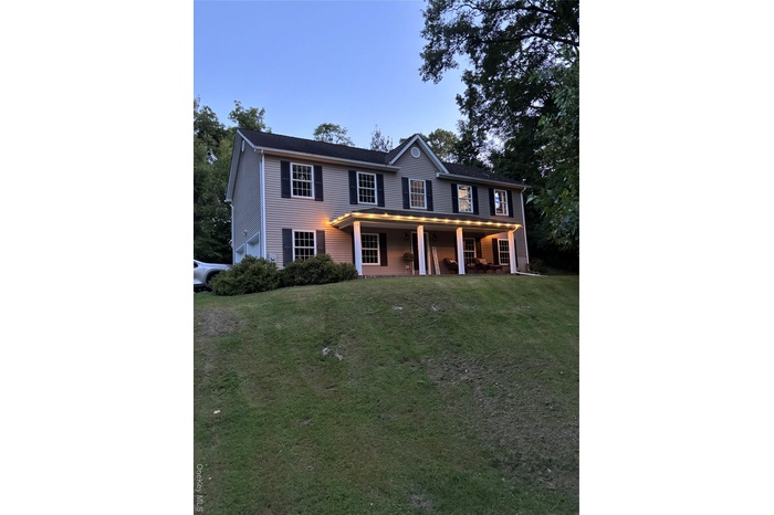 View of front of property with a front yard